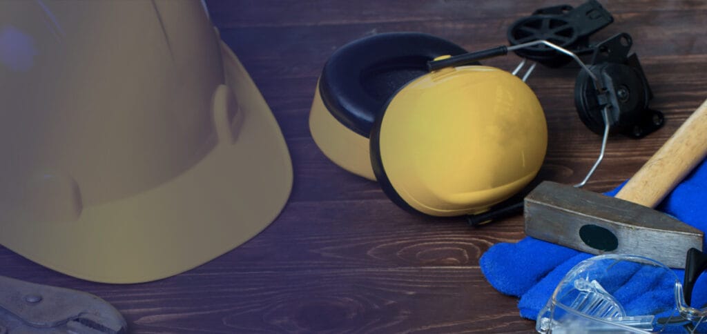 A pair of yellow ear muffs and a blue hat.