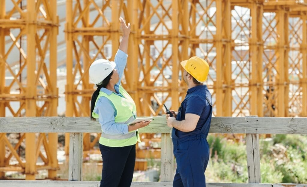 Construction workers reviewing site progress.