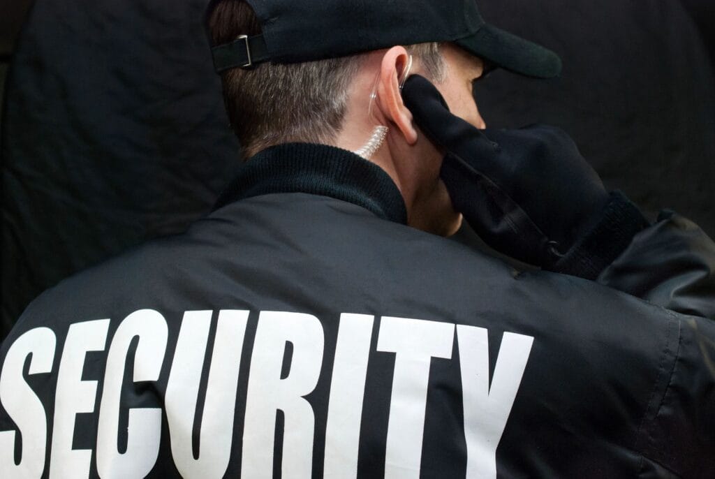 Security guard using earpiece.