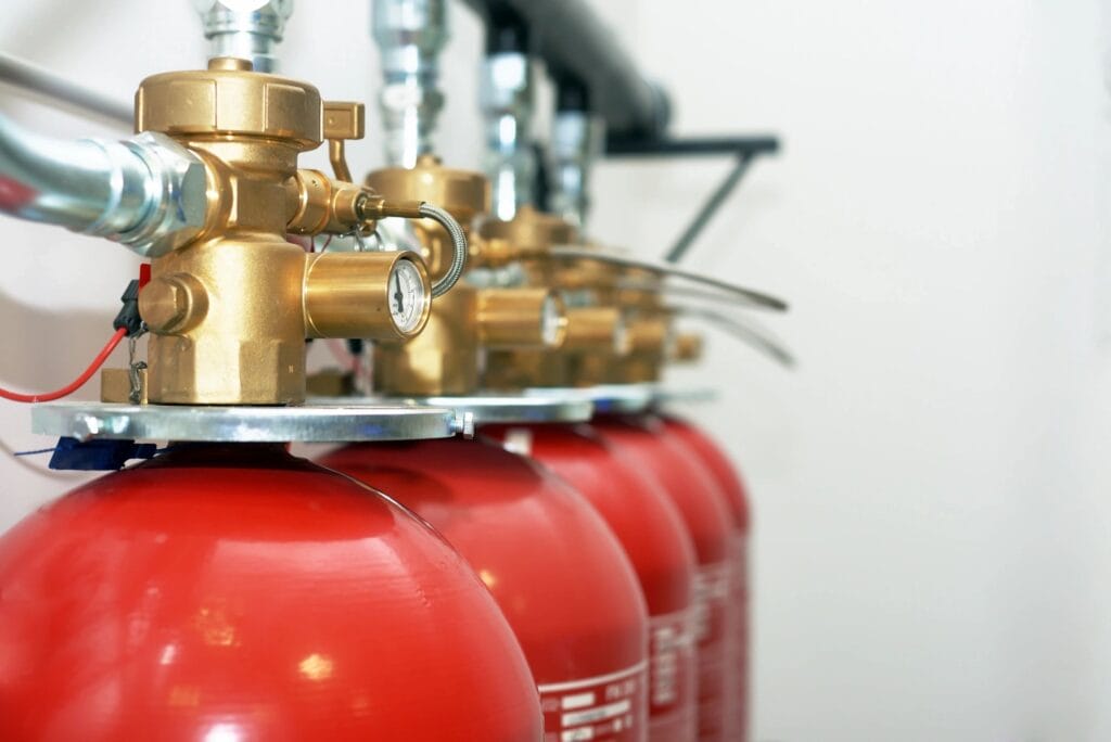 Row of fire suppression system tanks.
